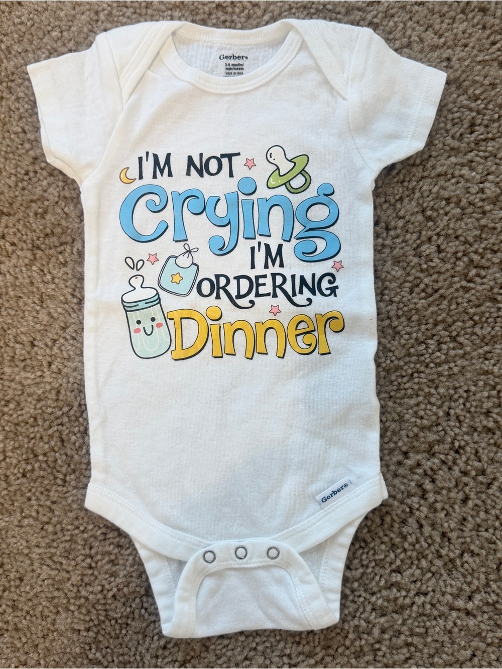 Gerber White Baby One-Piece with Blue and Yellow Graphic